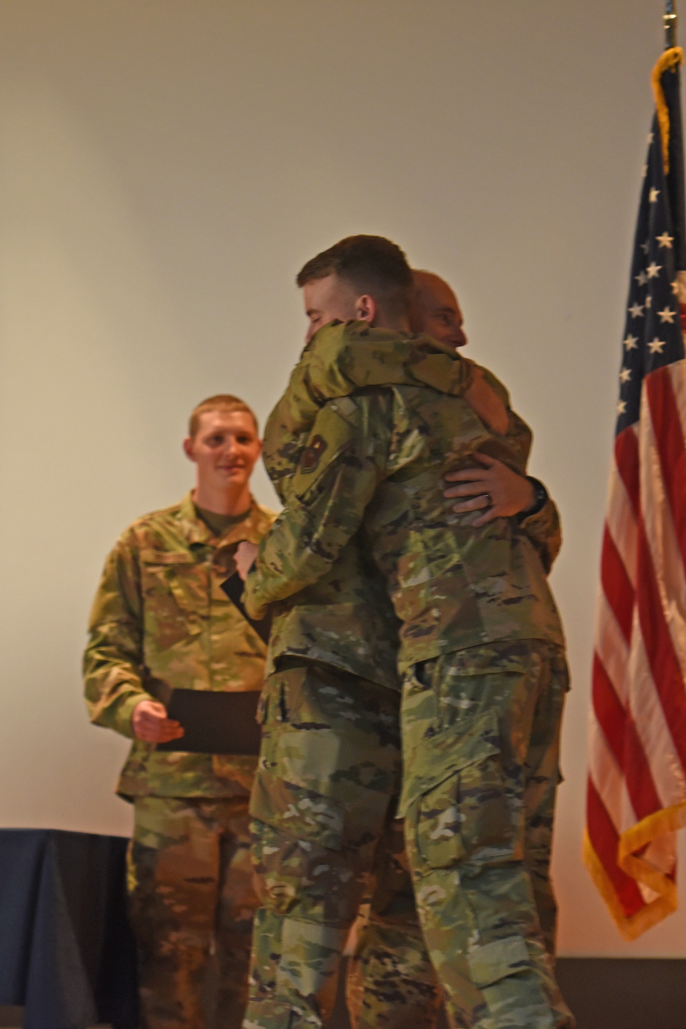 U.S. Air Force Lt. Gen. Kirk S. Pierce, commander of Continental U.S. North American Aerospace Defense Command Region and 1st Air Force (Air Forces Northern and Air Forces Space) (left), hugs his son 1st Lt. Kirk D. Pierce, 315th Training Squadron student (right), during the 315th TRS’s intelligence, surveillance, and reconnaissance professionals’ graduation ceremony, at Goodfellow Air Force Base, Texas, May 24, 2022. The 17th Training Wing has graduated more than 800,000 ISR professionals, who perform and manage intelligence functions and activities to support the United States and allied forces. (U.S. Air Force photo by Senior Airman Abbey Rieves)