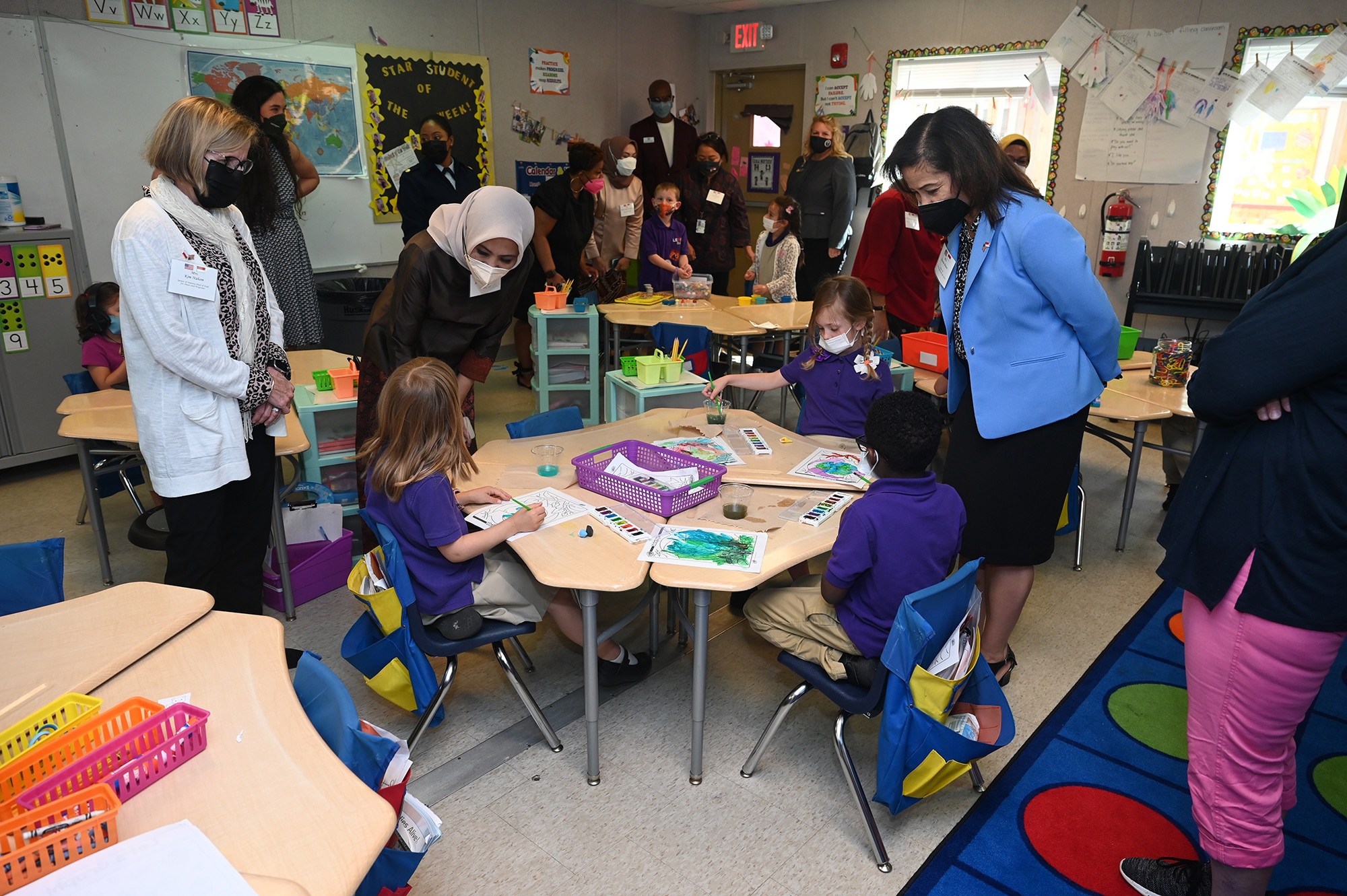 Wife of Air Force Chief of Staff Gen. Charles CQ Brown, Jr.,  Sharene Brown (right) tours a small school with visiting spouse of Indonesian  Air Chief Marshal Fadjar Prasetyo, Andarini Inong Putri (center) during a visit to Joint Base Anacostia-Bolling, Washington, D.C., May 19, 2022.  (U.S. Air Force photo by Andy Morataya)