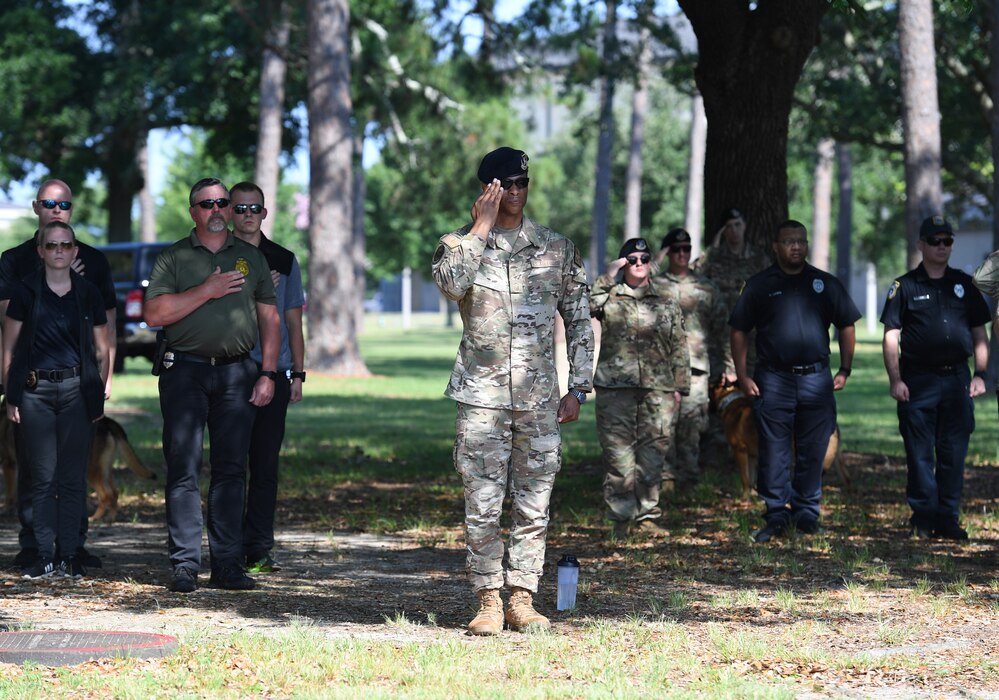 Members of the 81st Security Forces Squadron and local law enforcement agencies attend a retreat ceremony at Keesler Air Force Base, Mississippi, May 20, 2022. The ceremony, hosted by the 81st SFS, was the last of several events held in celebration of this year's Police Week. (U.S. Air Force photo by Kemberly Groue)