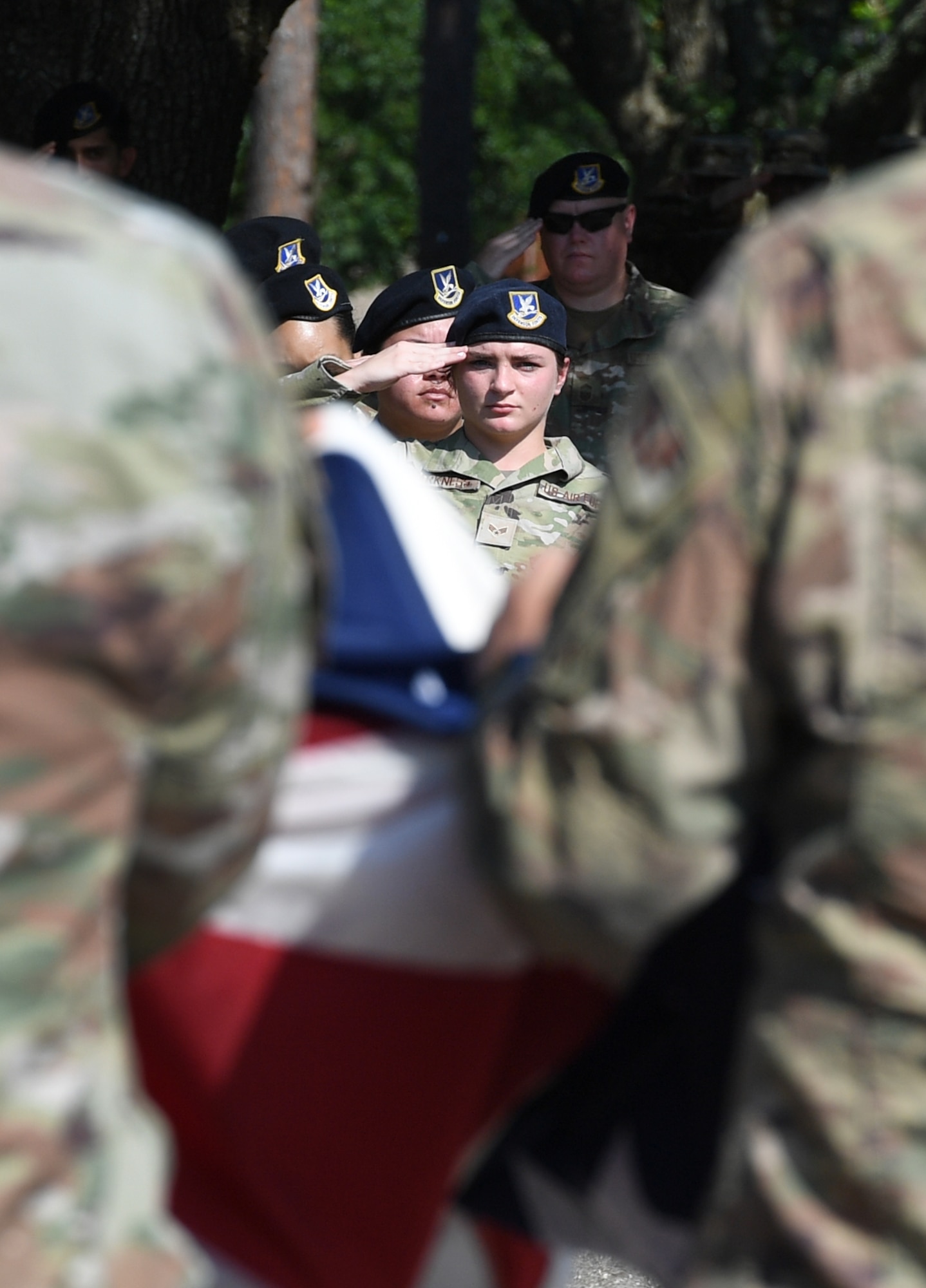 U.S. Air Force Senior Airman Joyce Harkeness, 81st Security Forces Squadron investigator, renders a salute during a retreat ceremony at Keesler Air Force Base, Mississippi, May 20, 2022. The ceremony, hosted by the 81st SFS, was the last of several events held in celebration of this year's Police Week. (U.S. Air Force photo by Kemberly Groue)