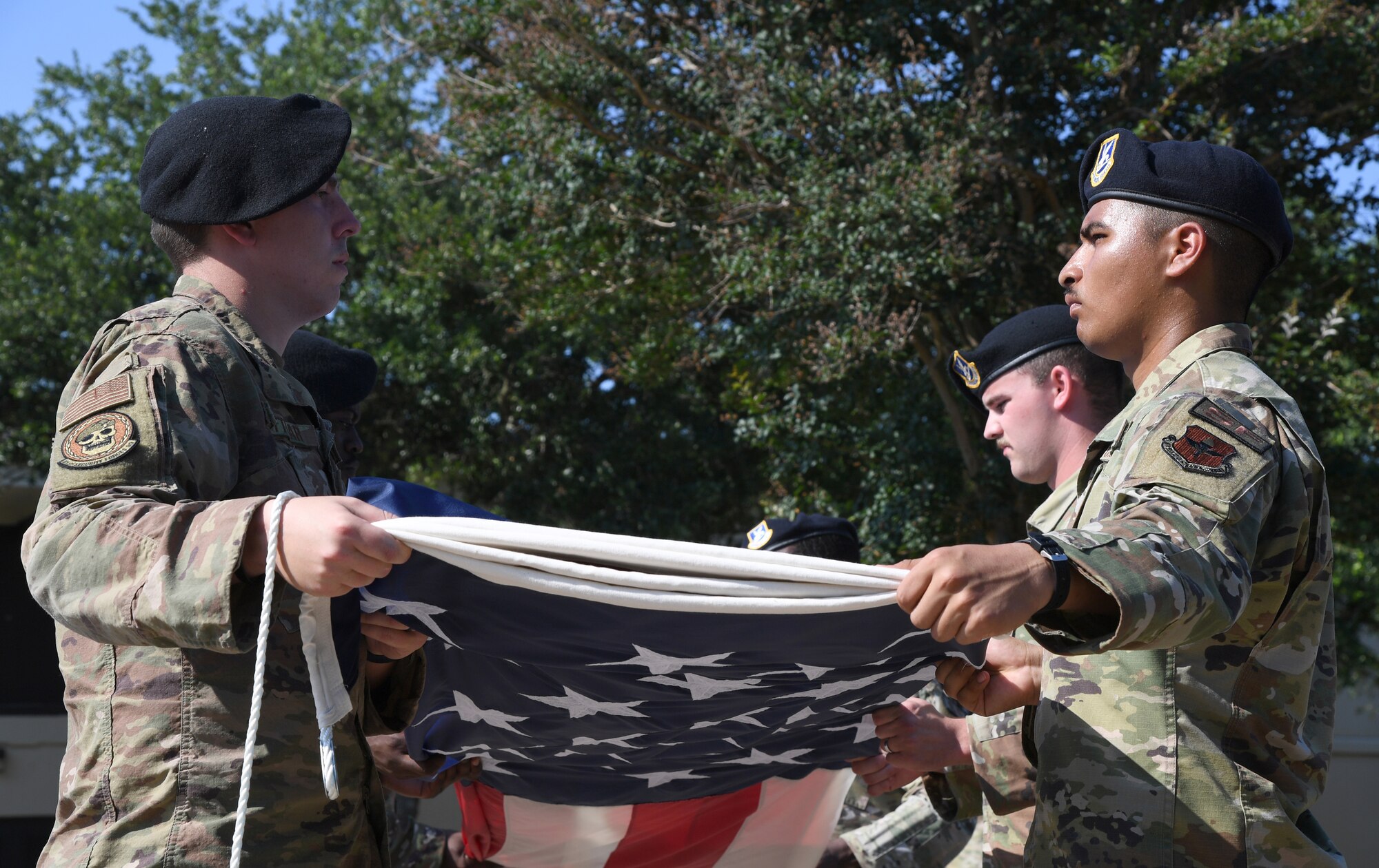 Members of the 81st Security Forces Squadron participate in a retreat ceremony at Keesler Air Force Base, Mississippi, May 20, 2022. The ceremony, hosted by the 81st SFS, was the last of several events held in celebration of this year's Police Week. (U.S. Air Force photo by Kemberly Groue)