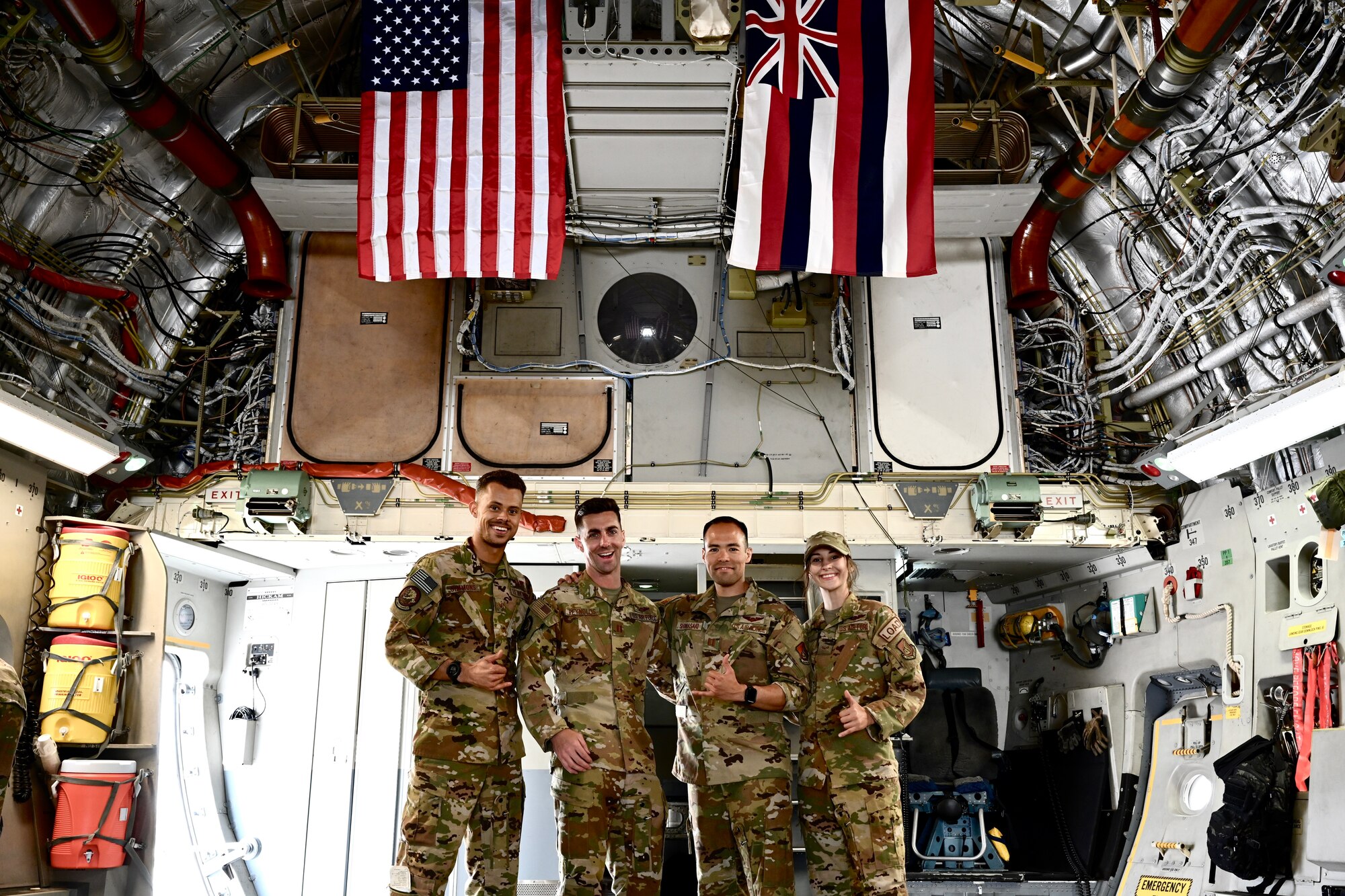 A U.S. Air Force Total Force C-17 Globemaster III, assigned to Joint Base Pearl Harbor-Hickam, Hawaii, pose for a photo inside a C-17 Globemaster III at Indianapolis International Airport, Indiana, May 22, 2022. U.S. Transportation Command expeditiously coordinated across federal agencies, including the Departments of Agriculture and Health and Human Services and the Food and Drug Administration, to support U.S. President Joe Biden’s direction to conduct Operation Fly Formula. (U.S. Air Force photo by 1st Lt. Emma Quirk)