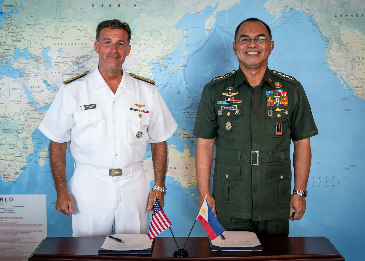 Adm. John C. Aquilino, Commander of U.S. Indo-Pacific Command, left, and Gen. Andres Centino, Chief of Staff of the Armed Forces of the Philippines, pose for a photo after signing the Maritime Security (Bantay Dagat) Framework at USINDOPACOM headquarters.