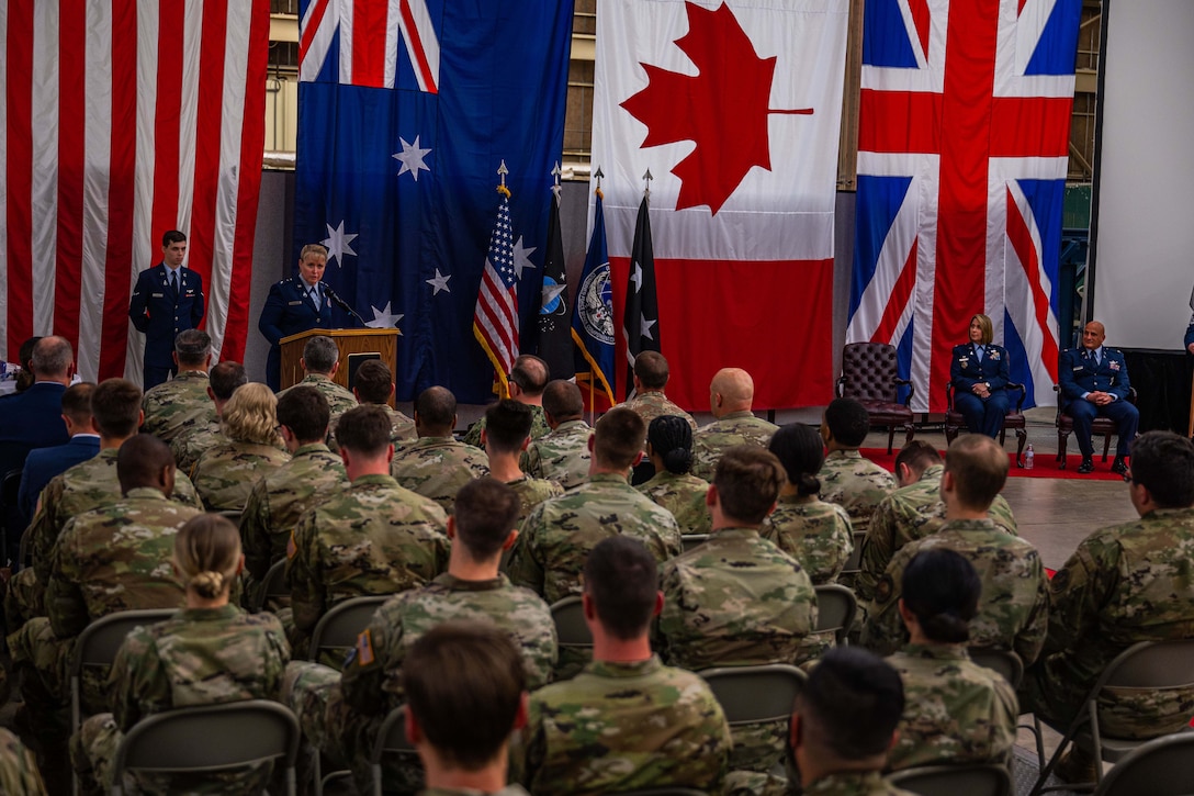 U.S. Space Force Maj. Gen. DeAnna Burt, Combined Force Space Component Command (CFSCC) commander and Space Operations Command (SpOC) vice commander, speaks at the podium while acting as the presiding officer for the Space Delta 5 change of command ceremony at Vandenberg Space Force Base, Calif., May 24, 2022. This was the first-ever change of command for DEL 5 since it was activated on July 24, 2020. (U.S. Space Force photo by Tech. Sgt. Luke Kitterman)