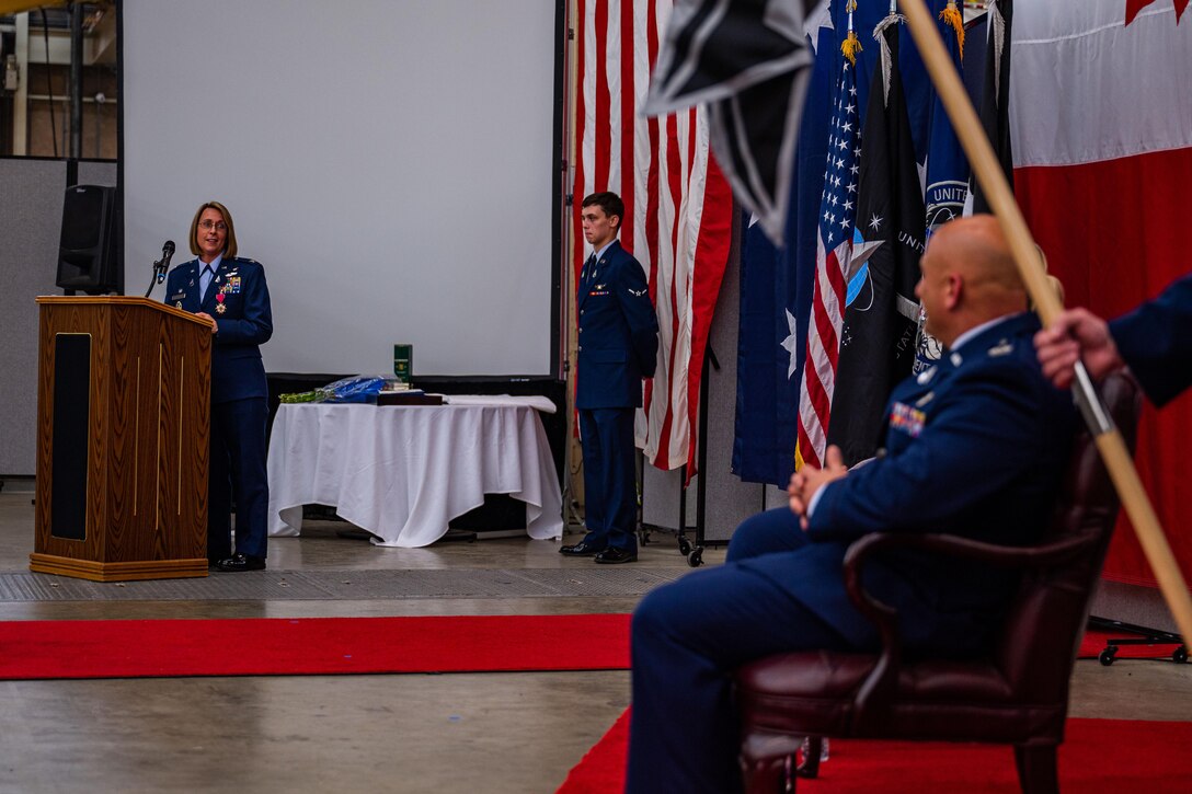 U.S. Space Force Col. Monique DeLauter, left, previous Space Delta 5 (DEL 5) commander and Combined Space Operations Center (CSpOC) director, speaks during the DEL 5 change of command ceremony at Vandenberg Space Force Base, Calif., May 24, 2022. DeLauter thanked leadership, family, friends and her team for their efforts and support during the time she spent as the DEL 5 commander and CSpOC director.  The CSpOC operates 24 hours a day, seven days a week to coordinate, plan, integrate, synchronize, and execute space operations. These actions provide tailored space effects on demand to support combatant commanders and accomplish national security objectives.  (U.S. Space Force photo by Tech. Sgt. Luke Kitterman)