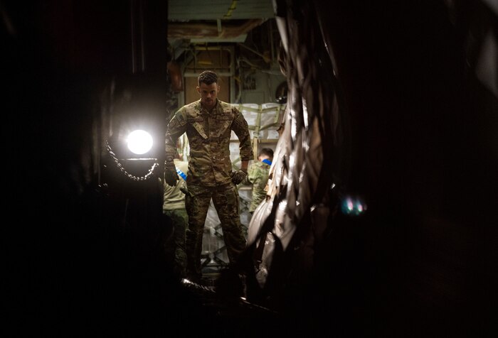 U.S. Air Force Staff Sgt. Austin Simmons, loadmaster assigned to Joint Base Pearl Harbor-Hickam, Hawaii, helps transport pallets of infant formula onto a C-17 Globemaster III aircraft during Operation Fly Formula at Ramstein Air Base, Germany, May 22, 2022. The President of the United States launched Operation Fly Formula to speed up the import of infant formula from Europe to the United States due to critical shortages there.  The formula will be transported to Plainfield, Indiana via a U.S. Air Force C-17 Globemaster III coordinated by U.S. Transportation Command and Air Mobility Command. (U.S. Air Force photo by Staff Sgt. Jacob Wongwai)