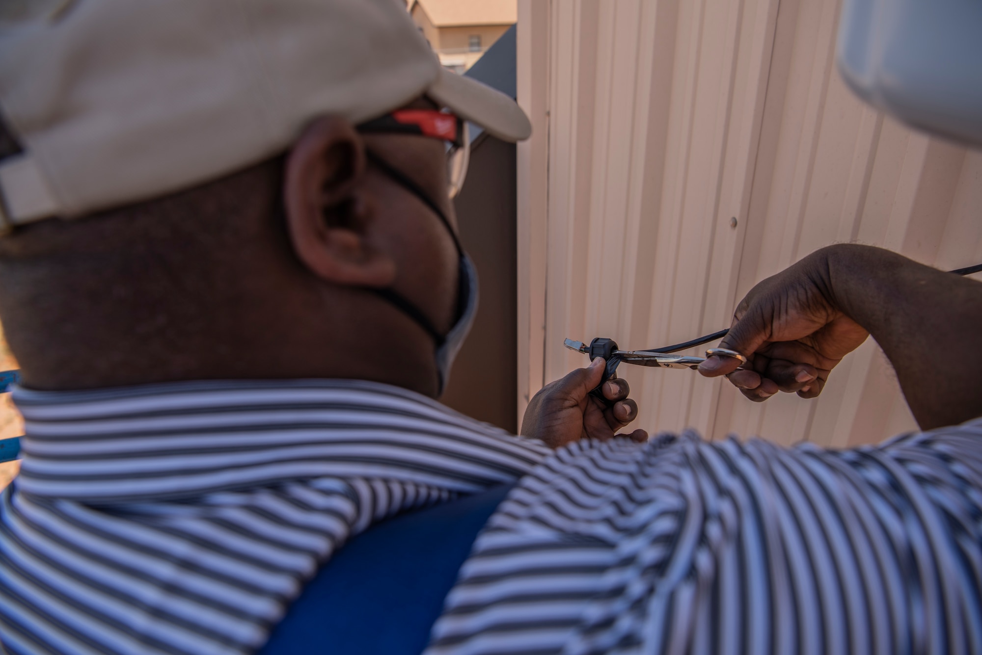 Cory Brown, installation technician for By Light, installs Wi-Fi at Dyess Air Force Base, Texas, May 11, 2022. Dy-Fi is one of many modernization initiatives meant to help Airmen accomplish the mission efficiently at Dyess. (U.S. Air Force photo by Airman 1st Class Ryan Hayman)