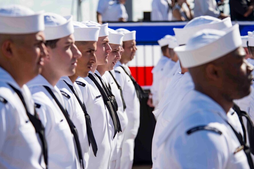 Service members stand in formation.