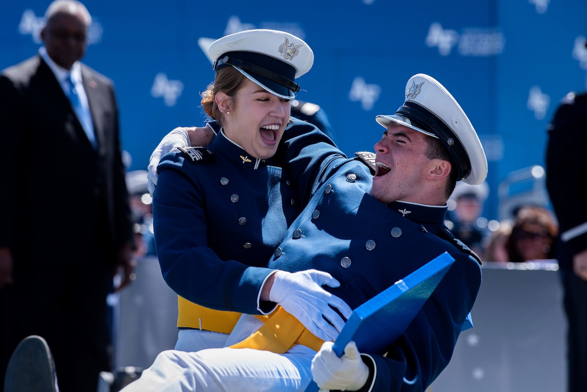 Cadets celebrate together after receiving their diplomas during the U.S. Air Force Academy Class of 2022 Graduation Ceremony at the Air Force Academy in Colorado Springs, Colo., May 25, 2022. Nine-hundred-seventy cadets crossed the stage to become the Air Force and Space Force’s newest second lieutenants. (U.S. Air Force photo by Trevor Cokley)