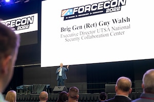 Brig. Gen. (Ret.) Guy Walsh, Executive Director of University of San Antonio National Security Collaboration Center, gives opening remarks during the Air Education and Training Command Innovation Day of FORCECON 2022