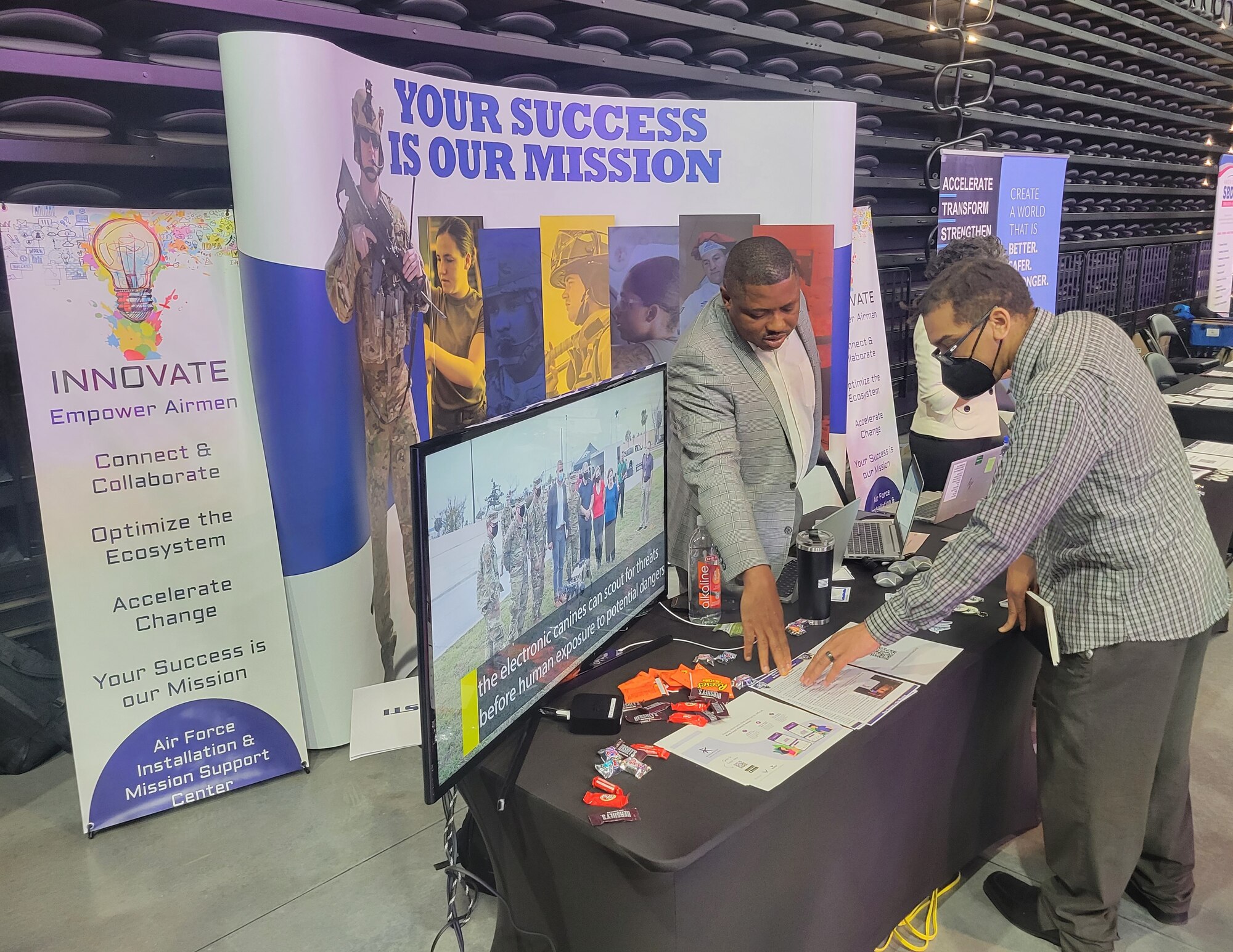 two people talking at booth