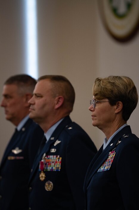 People standing at attention during a change of command ceremony.