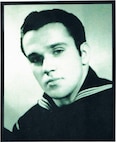 Official Coast Guard photograph of Seaman First Class Fletcher Burton in dress blues. (U.S. Coast Guard)