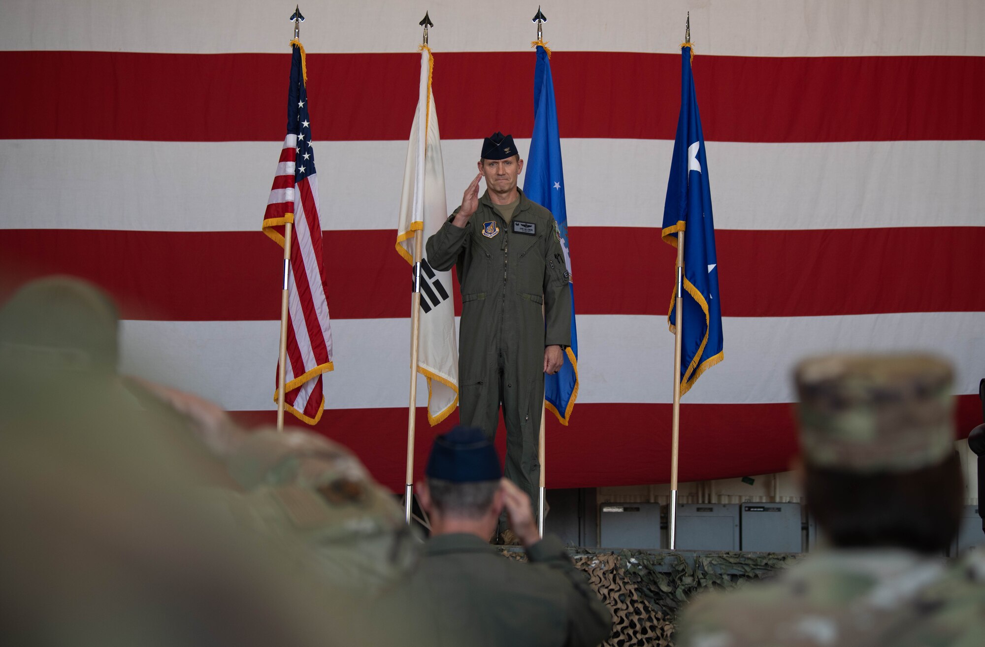 Col. John B. Gallemore, Wolf 61, delivers his final salute as the 8th Fighter Wing commander during the wing change of command ceremony at Kunsan Air Base, Republic of Korea, May 26, 2022. Unlike many command positions within the U.S. Air Force, being the 8th FW commander, or “Wolf,” means serving a one-year controlled tour. (U.S. Air Force Photo by Senior Airman Shannon Braaten)