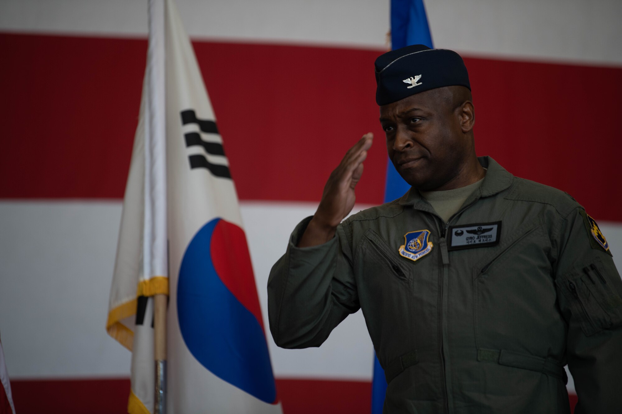 Col. Henry R. Jeffress, III, incoming 8th Fighter Wing commander, salutes Wolf Pack Airmen during the wing change of command ceremony at Kunsan Air Base, Republic of Korea, May 26, 2022. Jeffress, or Wolf 62, assumed command of the 8th FW from the outgoing commander, Col. John B. Gallemore. (U.S. Air Force Photo by Senior Airman Shannon Braaten)