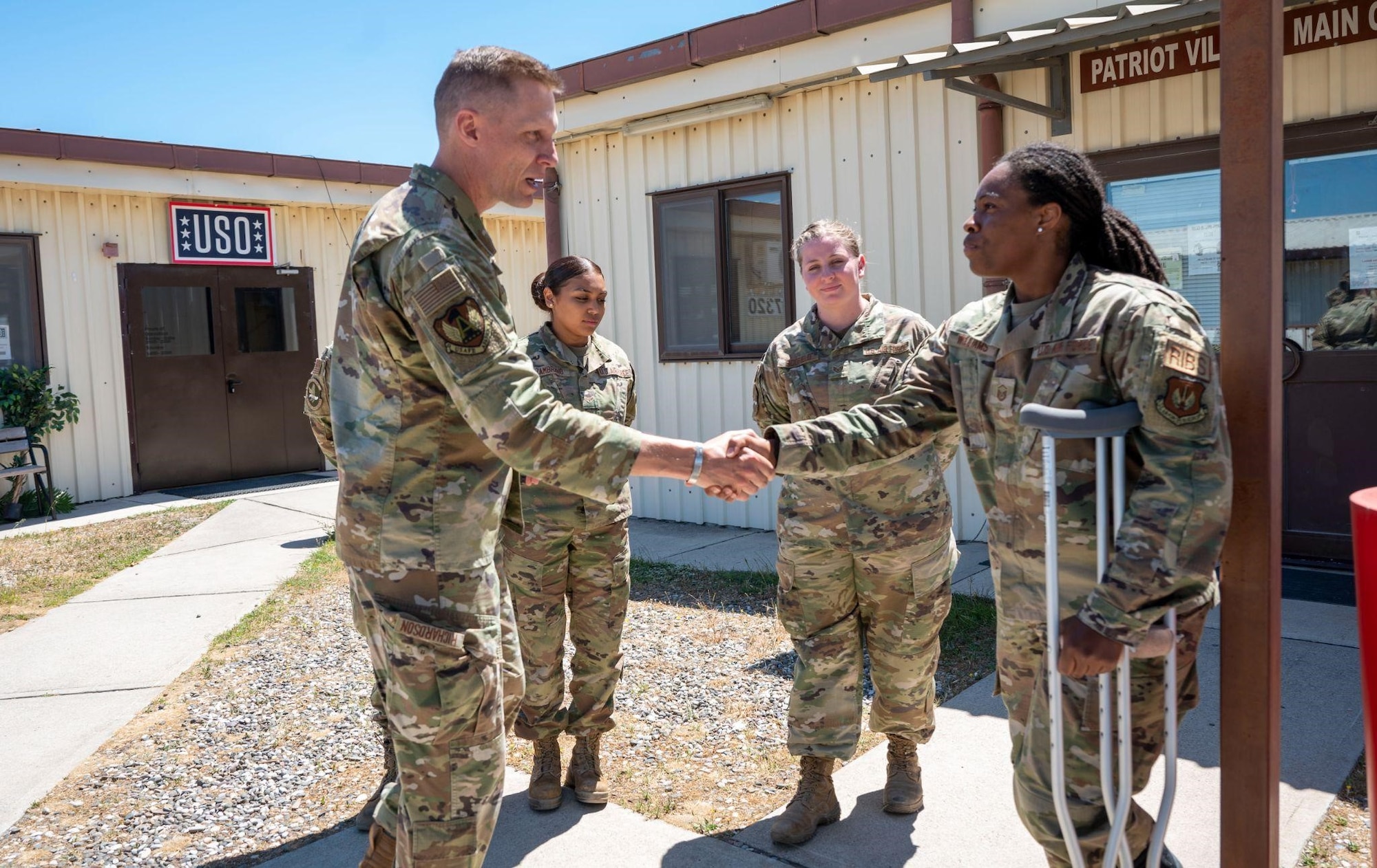 Col. Ryan Richardson, United States Air Forces in Europe - Air Forces Africa Director of Manpower, Personnel, and Services, coins Master Sgt. Lenora Willams, contingency beddown operations section chief deployed to the 39th Force Support Squadron, for her exemplary work and performance during her time at Incirlik Air Base, Turkey, May 20, 2022. Richardson is responsible for the command’s Force Support portfolio of activities and programs supporting military, civilian, and partner personnel, families, and retirees across the European and African theaters. (U.S. Air Force photo by Staff Sgt. Gabrielle Winn)