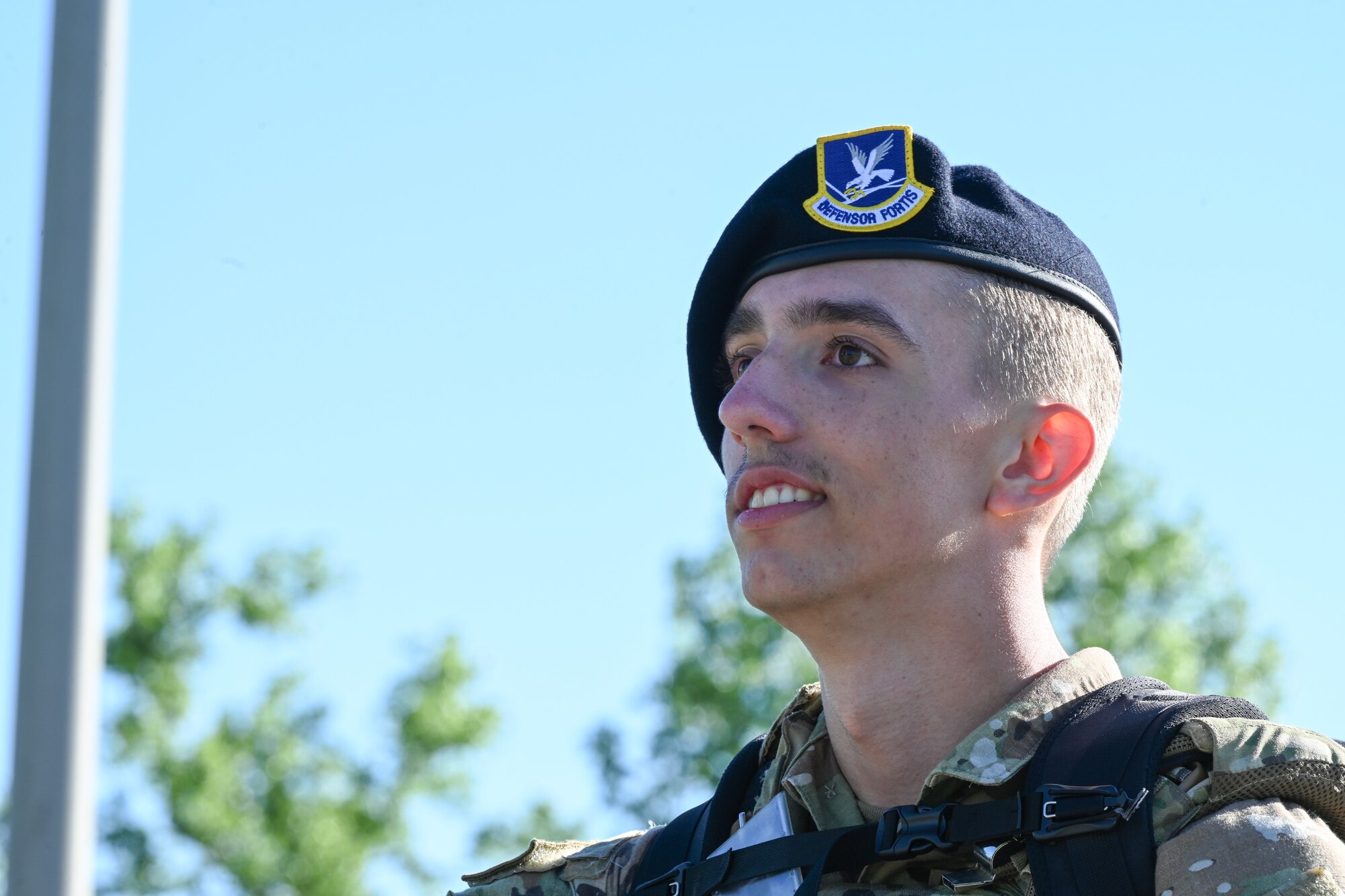 Airman 1st Class Corey Ruffule, 509th Security Forces Squadron security response team member, rucks during the annual police week memorial ruck march on Whiteman Air Force Base, Mo., May 16, 2022. Participants rucked four miles stopping at eight different stations to honor fallen defenders, doing various exercises at each station. (U.S. Air Force photo by Airman 1st Class Bryson Britt)