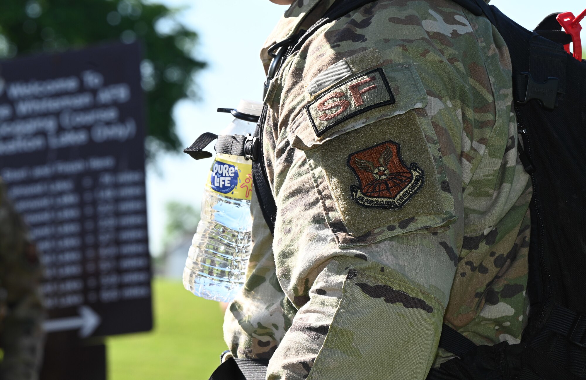 Members of the 509th Bomb Wing ruck during the annual police week memorial ruck march on Whiteman Air Force Base, Mo., May 16, 2022. Participants rucked four miles stopping at eight different stations to honor fallen defenders, doing various exercises at each station. (U.S. Air Force photo by Airman 1st Class Bryson Britt)