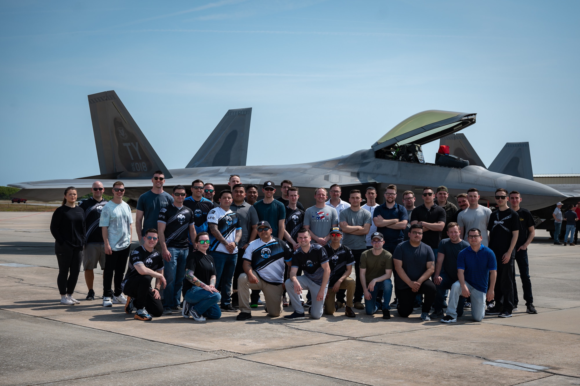 U.S. Air Force and U.S. Space Force gaming teams tour F-22 Raptors at Patrick Space Force Base, Fla., May 19, 2022. The top teams from the Spring season of the Department of the Air Force Gaming competed at PSFB for a chance to represent the USAF and the USSF at FORCECON 2022, the Armed Forces Sports Halo Championship, and the first ever U.S. government esports event. (U.S. Space Force photo by Senior Airman Thomas Sjoberg)