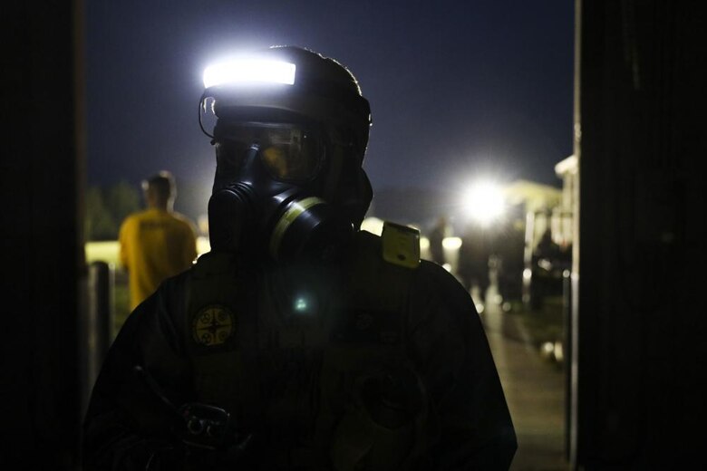 U.S. Marines with Alpha Company, Chemical Biological Incident Response Force (CBIRF), conduct proper decontamination procedures after extracting notional casualties from a simulated nuclear detonation training area during Scarlet Response 2022 at Guardian Centers of Georgia, Georgia, May 19, 2022. CBIRF Marines will bring casualties to decontamination tents, decontaminate and move them into a clean area for advanced medical care. Scarlet Response 2022 is designed to physically and mentally test CBIRF personnel and the unit’s joint partners, the 911th Technical Rescue Engineer Company, in a simulated joint disaster response. (U.S. Marine Corps photo by Sgt. Kealii De Los Santos)