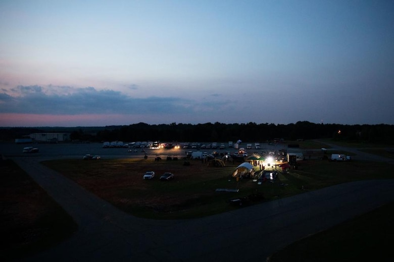 U.S. Marines with Alpha Company, Chemical Biological Incident Response Force (CBIRF), conduct proper decontamination procedures after extracting notional casualties from a simulated nuclear detonation training area during Scarlet Response 2022 at Guardian Centers of Georgia, Georgia, May 19, 2022. CBIRF Marines will bring casualties to decontamination tents, decontaminate and move them into a clean area for advanced medical care. Scarlet Response 2022 is designed to physically and mentally test CBIRF personnel and the unit’s joint partners, the 911th Technical Rescue Engineer Company, in a simulated joint disaster response. (U.S. Marine Corps photo by Sgt. Kealii De Los Santos)