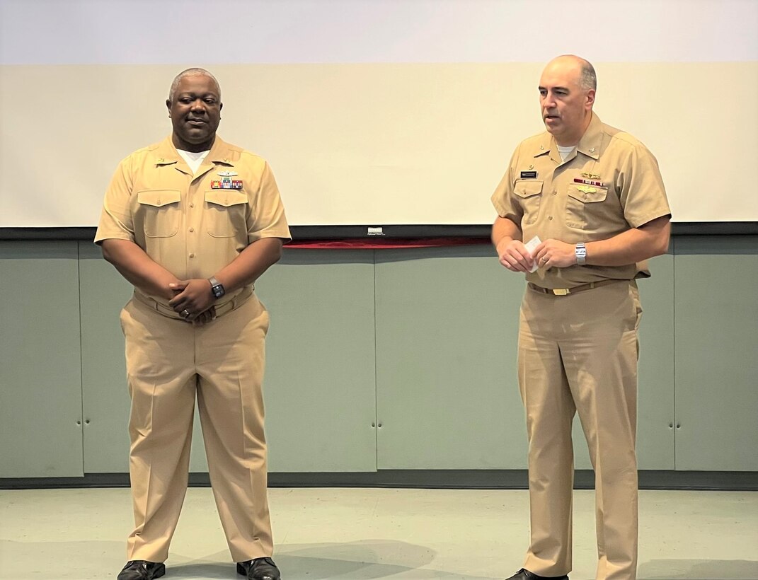 IMAGE: Naval Surface Warfare Center Dahlgren Division Commanding Officer Capt. Philip Mlynarski swears-in newly promoted Master Chief Petty Officer Justin Preyer during a Naval frocking ceremony on May 25 at Mayport Navy Base in Jacksonville, Florida.