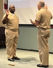 IMAGE: Naval Surface Warfare Center Dahlgren Division Commanding Officer Capt. Philip Mlynarski swears-in newly promoted Master Chief Petty Officer Justin Preyer during a Naval frocking ceremony on May 25 at Mayport Navy Base in Jacksonville, Florida.