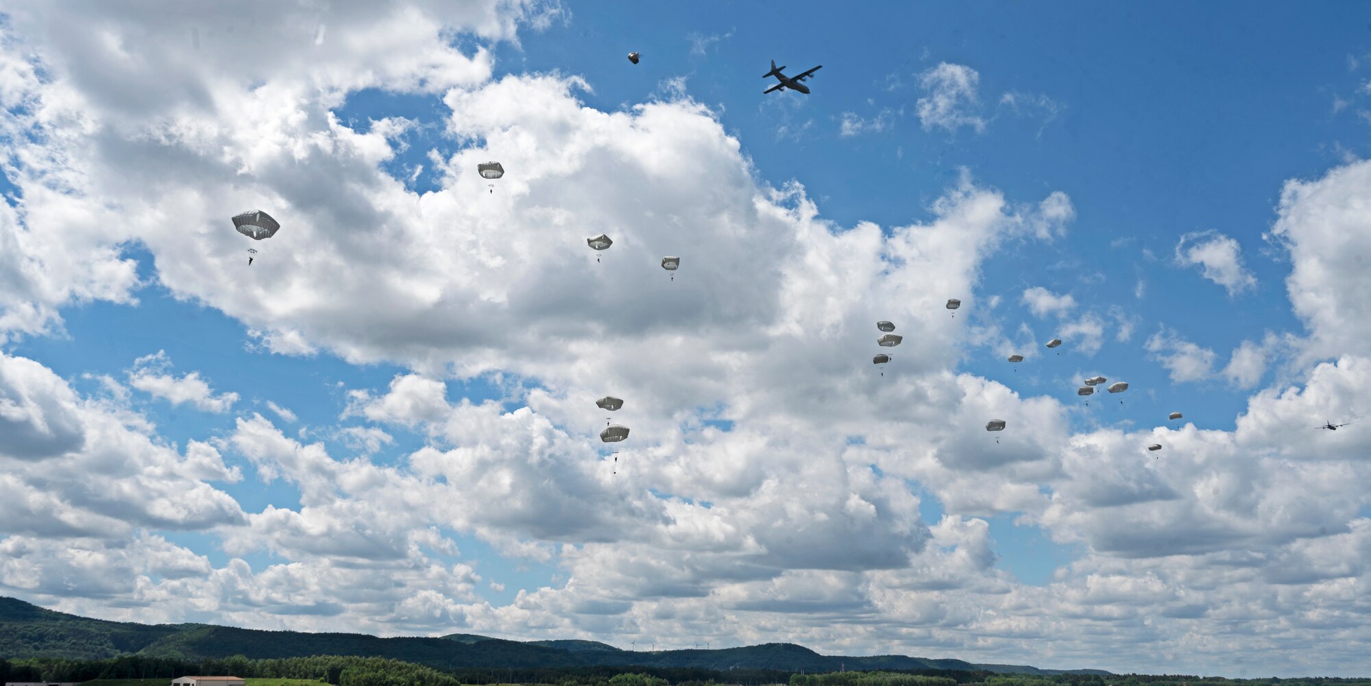 Eighty U.S. service members parachute out of C-130J Super Hercules