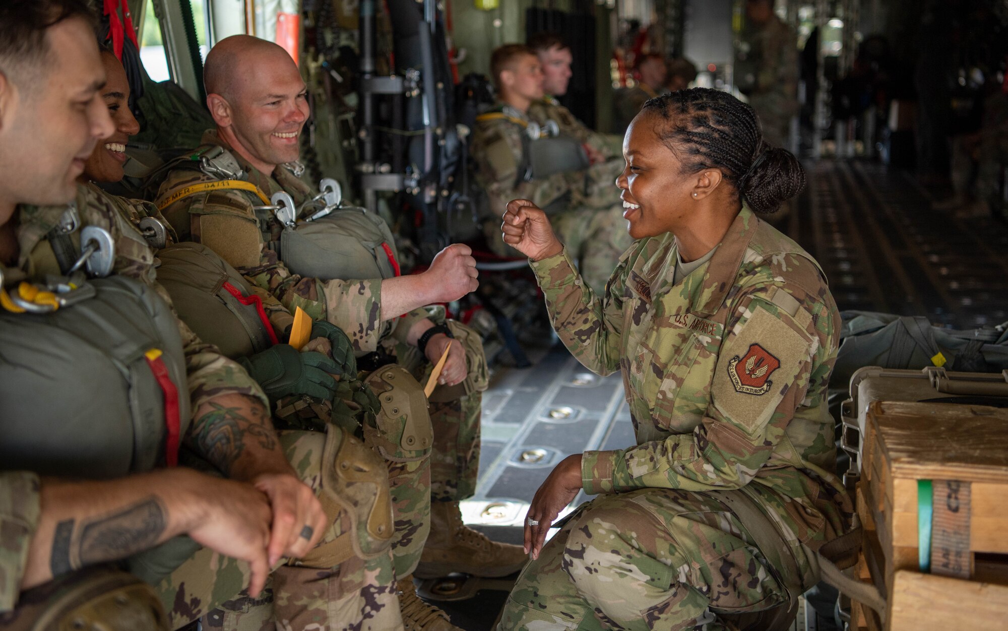 U.S. Air Force Chief Master Sgt. Charmaine Kelley, 86th Airlift Wing command chief, greets paratroopers