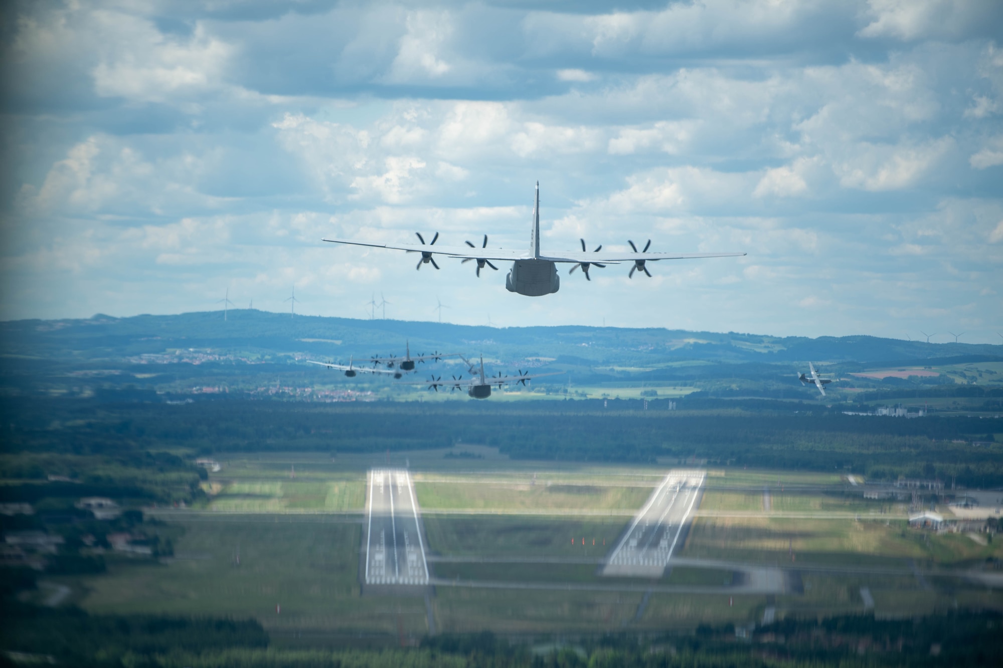 Nine C-130J Super Hercules come in for landing