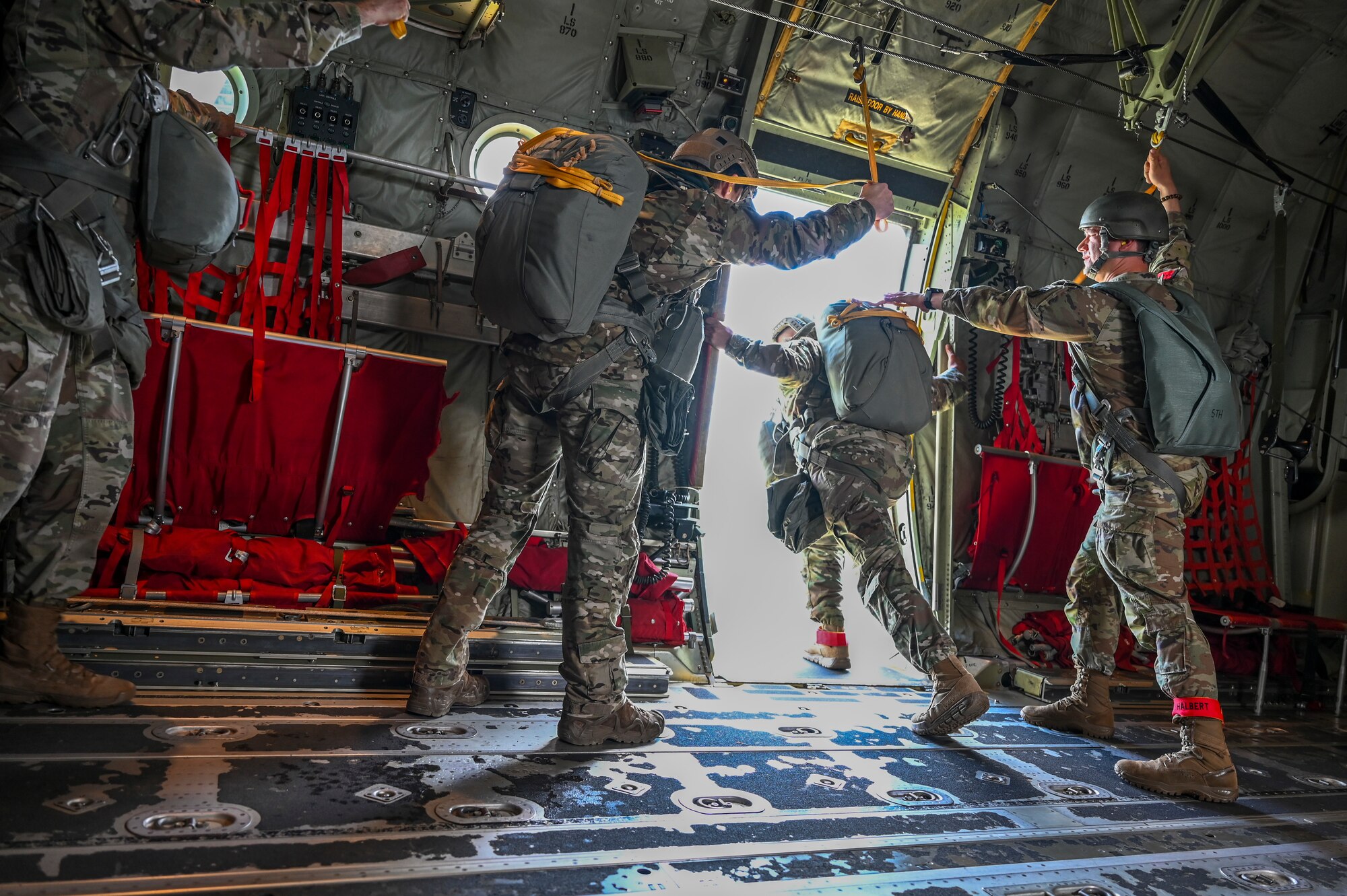 U.S. Army paratroopers from 1st Battalion, 10th Special Forces Group from Stuttgart, Germany, jump out of a C-130J Super Hercules