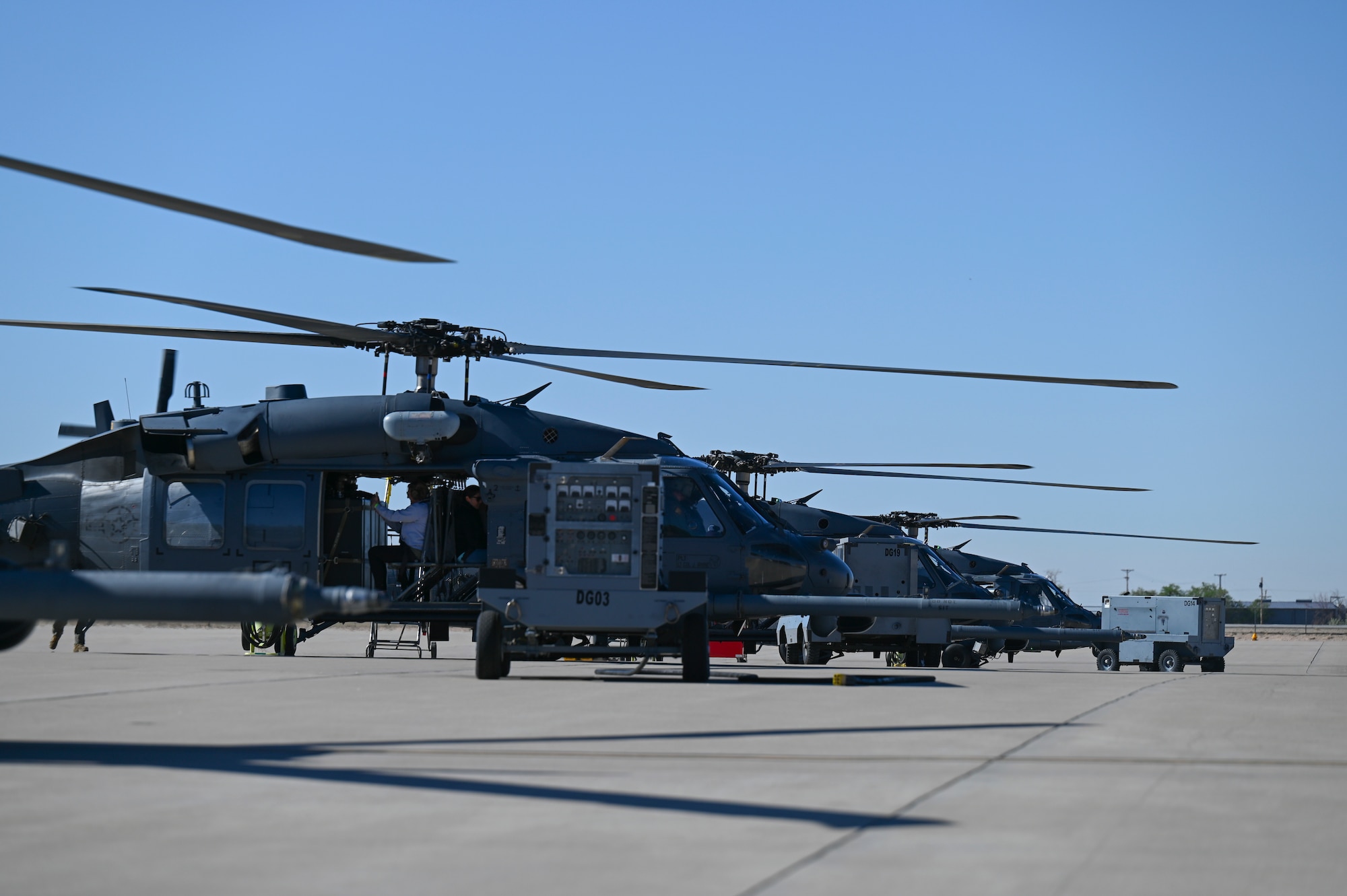 Family members of the 58th  and 150th Special Operations Wings waiting to take off in the HH-60 Pave Hawk for an orientation flight as part of the annual Spouses Day event at Kirtland Air Force Base, New Mexico. May 14, 2022. This event was especially important to the 150th SOW as the Air National Guard spouses don’t visit Kirtland AFB as frequently as the active duty spouses. (U.S. Air Force photo by Amn Tallon Bratton.)