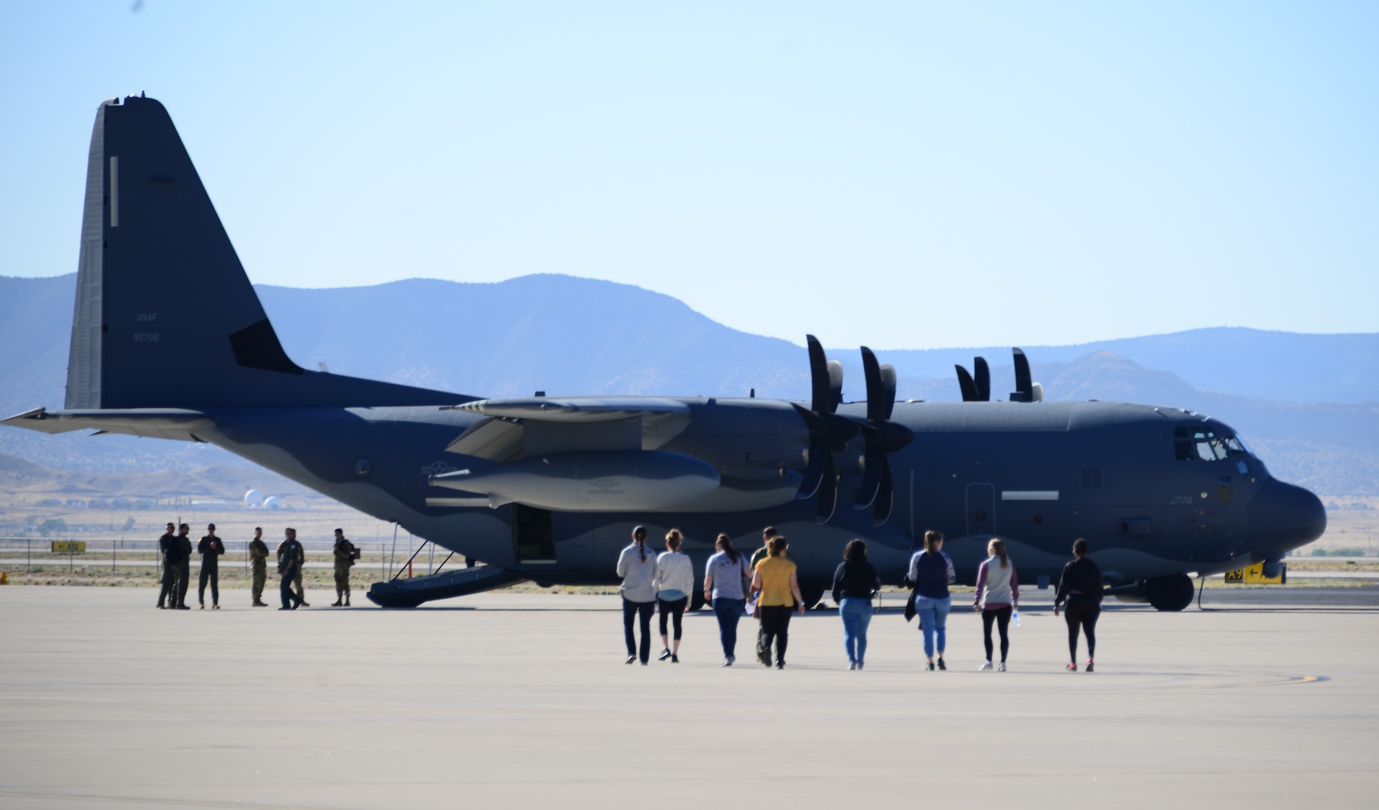 Family members of the 150th and 58th Special Operations Wings boarding the C-130J for an orientation flight as part of the  annual Spouses Day event at Kirtland Air Force Base, New Mexico. May 14, 2022. (U.S. Air Force photo by Jeremy T. Dyer.)
