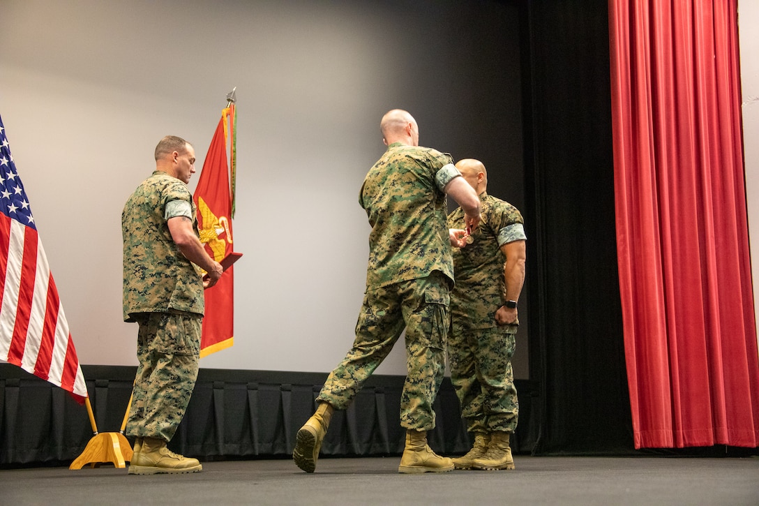 Marine Corps Logistics Base Albany officials held a post and relief ceremony, May 26, at the Base Theater.  Master Sgt. Jamil P. Alkattan, acting Base Sergeant Major Master relinquished his post by transferring the sword of office to incoming Base Sergeant Major Chad M. Coston.  Alkattan, who will be departing soon for Camp Pendleton, California, received the Meritorious Service Medal.