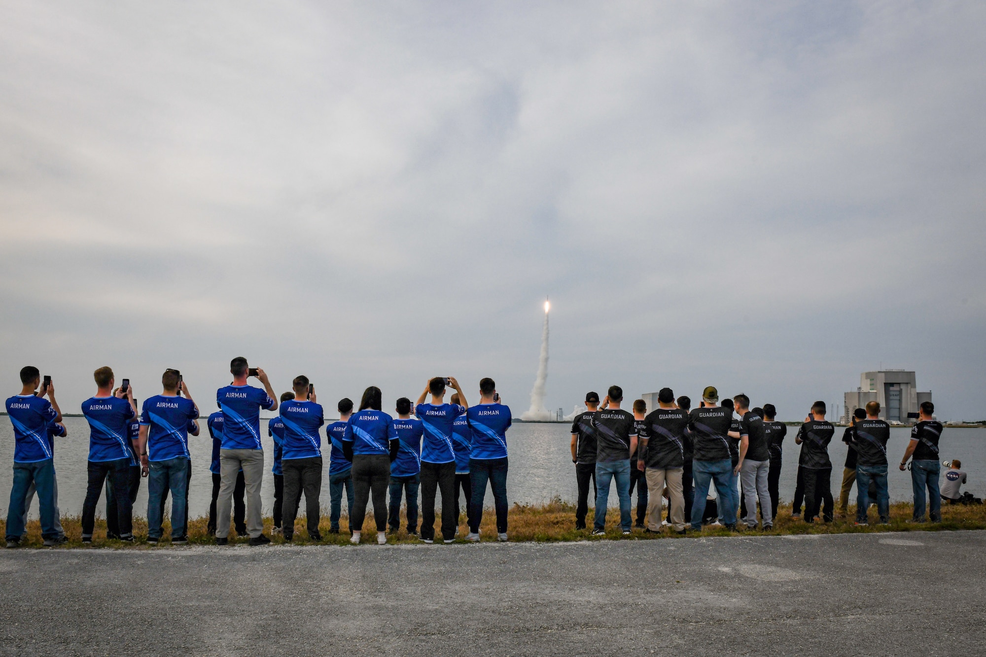 U.S. Air Force and U.S. Space Force gaming teams watch a rocket launch at Cape Canaveral Space Force Station, Fla., May 19, 2022. The top teams from the Spring season of the Department of the Air Force Gaming competed at Patrick Space Force Base, Fla., for a chance to represent the USAF and the USSF at FORCECON 2022, the Armed Forces Sports Halo Championship, and the first ever U.S. government esports event. (U.S. Space Force photo by Senior Airman Thomas Sjoberg)