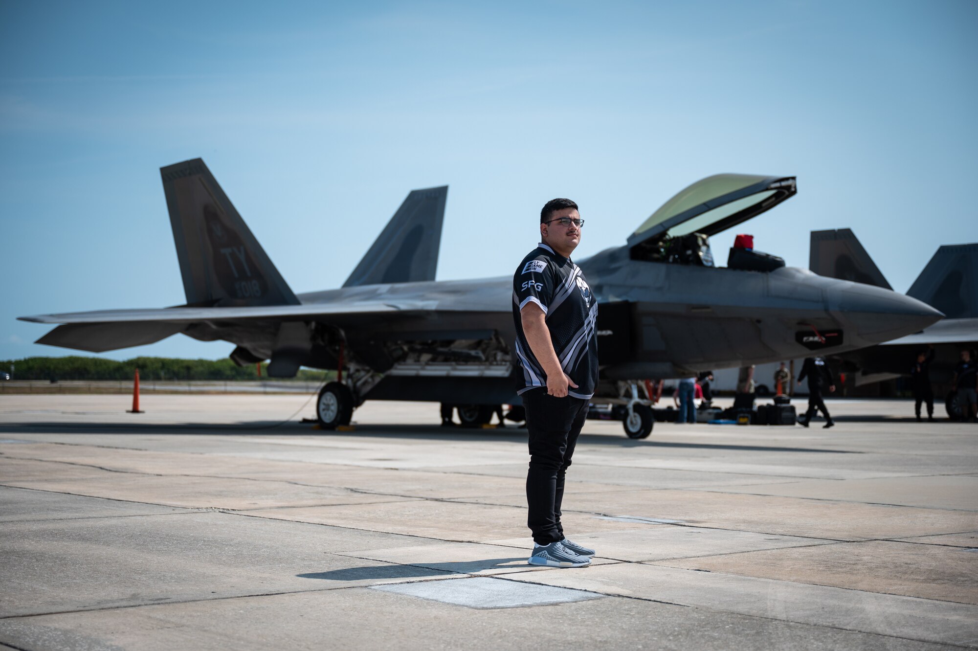 U.S. Air Force and U.S. Space Force gaming teams tour F-22 Raptors at Patrick Space Force Base, Fla., May 19, 2022. The top teams from the Spring season of the Department of the Air Force Gaming competed at PSFB for a chance to represent the USAF and the USSF at FORCECON 2022, the Armed Forces Sports Halo Championship, and the first ever U.S. government esports event. (U.S. Space Force photo by Senior Airman Thomas Sjoberg)