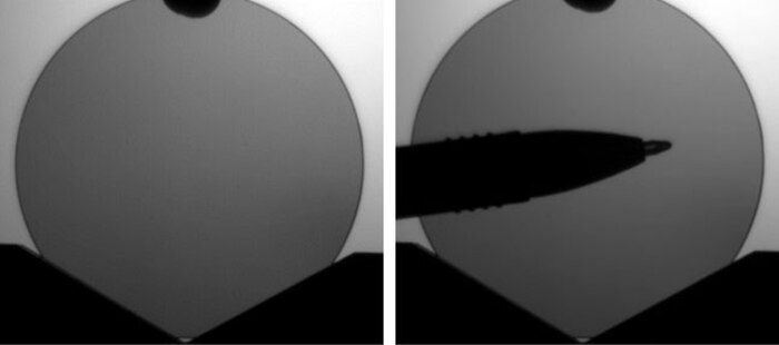 Photo on the Left:  A pristine 50 mm diameter ternary III-V semiconductor wafer produced at a United Semiconductors facility in Los Alamitos, California.(Courtesy photo)Photo on the Right:  A pristine, distortion-free 50 mm diameter ternary III-V semiconductor wafer produced at a United Semiconductors facility  in Los Alamitos, California.  The pen placed underneath displays the wafer's distortion-free clarity. (Courtesy photo)