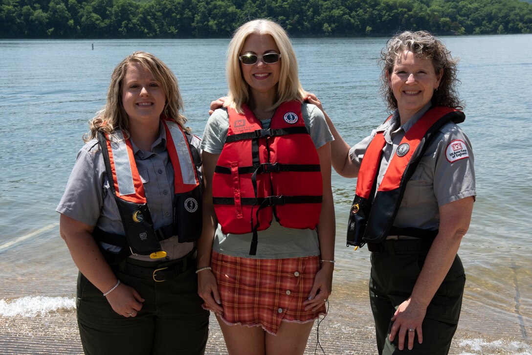Singer and Songwriter Delnora Reed joins Park Ranger Ashley Webster (Left) and Sondra Carmen at Center Hill Lake’s Hurricane Bridge Recreation Area in Smithville, Tennessee, May 12, 2022, to partner with the U.S. Army Corps of Engineers to promote water safety. She said she is thankful for her life jacket when visiting Corps lakes. (USACE Photo by Lee Roberts)