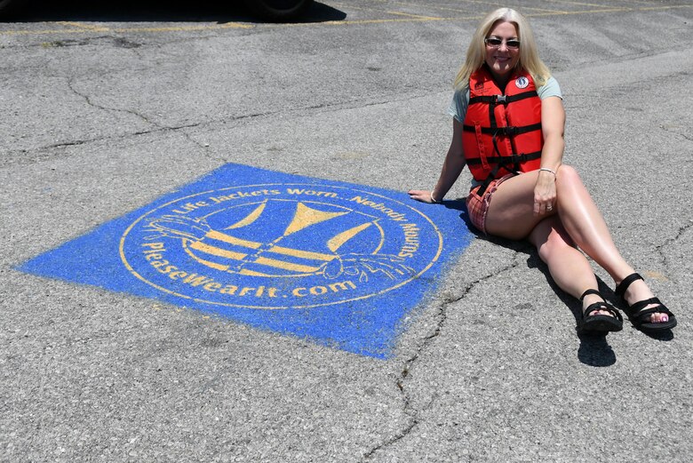 Singer and Songwriter Delnora Reed poses May 12, 2022, by the “Life Jackets Worn, Nobody Mourns” Campaign logo near the boat ramp at Hurricane Bridge Recreation Area in Smithville, Tennessee. Delnora filmed a water safety public service announcement in partnership with the U.S. Army Corps of Engineers. (USACE Photo by Misty Cunningham)