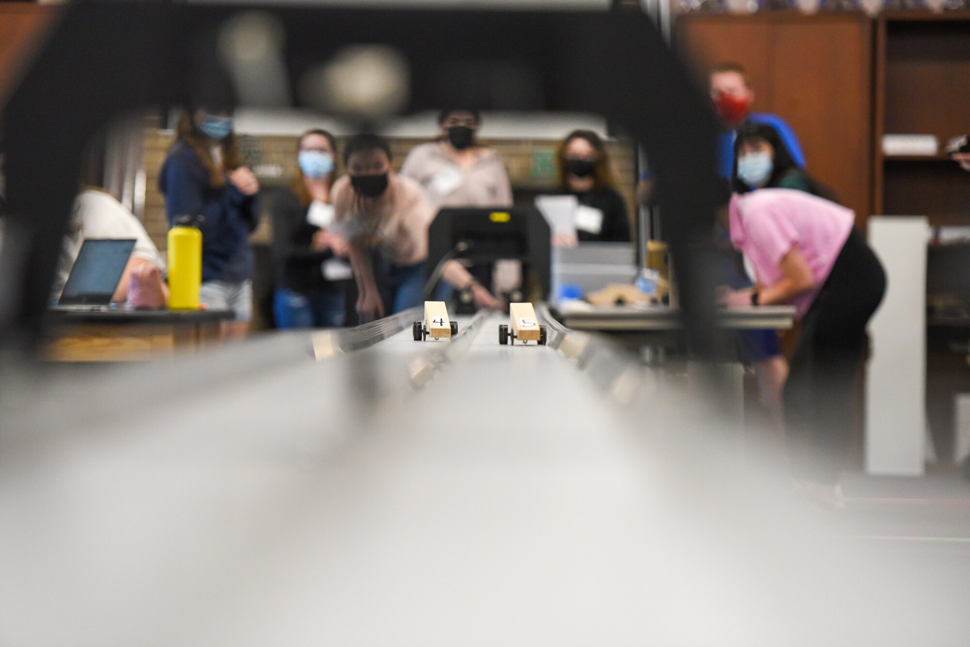 student teachers send test rockets, test cars down a track to study motion, and physics at STARBASE Academy