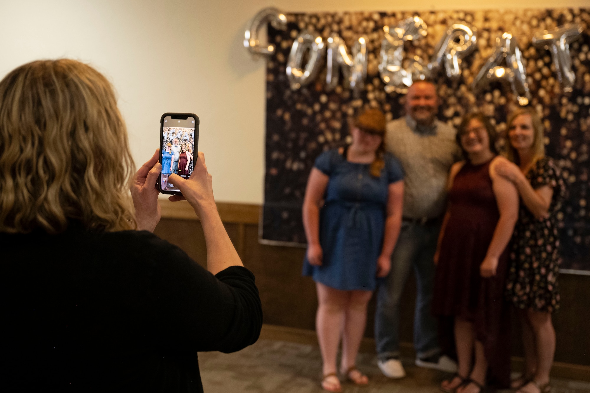 Alyssa Bailey, Project SEARCH intern, poses with family after graduation, May 24, 2022, on Holloman Air Force Base, New Mexico.