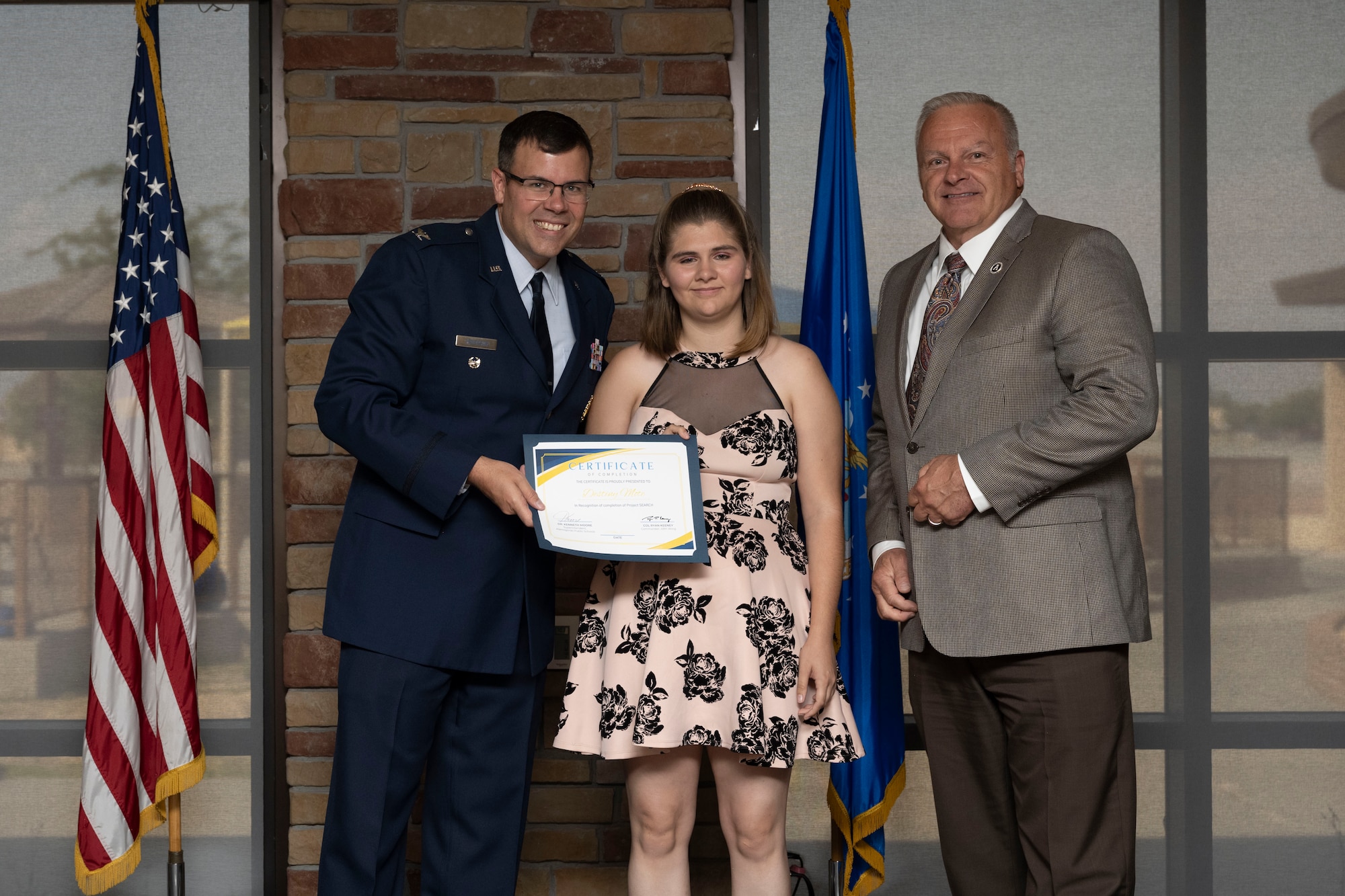 Destiny Mote, Project SEARCH intern, receives graduation certificate, May 24, 2022, on Holloman Air Force Base, New Mexico.