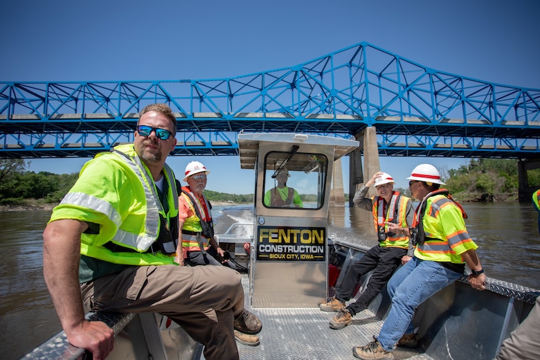 Christopher Svendsen, Hydraulic Engineer, US Army Corps of Engineers, Omaha District, and others make their way to the Florence bedrock removal project on the Missouri River, May 18, 2022.
