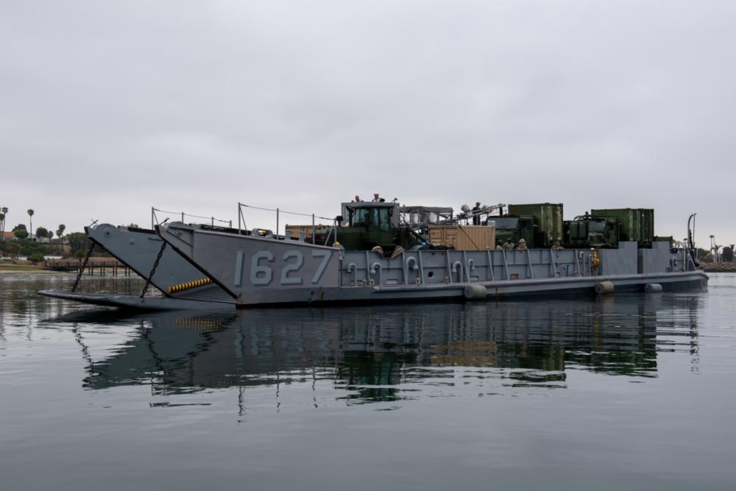 Landing Craft Utility pulls into boating dock