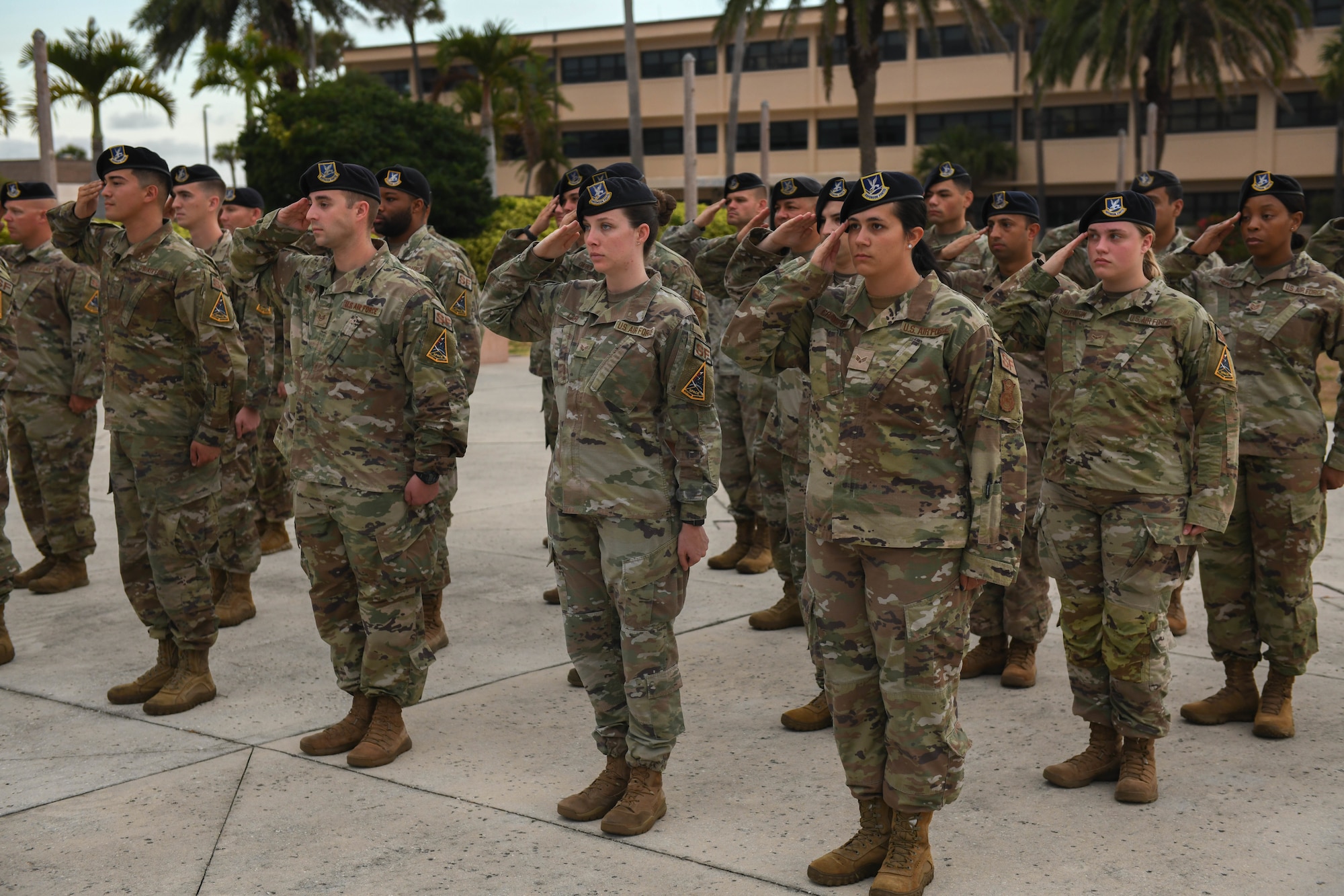 U.S. Air Force 45th Security Forces Squadron defenders, salute the American flag May 20, 2022, at Patrick Space Force Base, Fla. Defenders at the fallen hero ceremony salute the flag to recognize and honor all lives that were lost in the line of service for the United States. (U.S. Space Force photo by Airman 1st Class Samuel Becker)