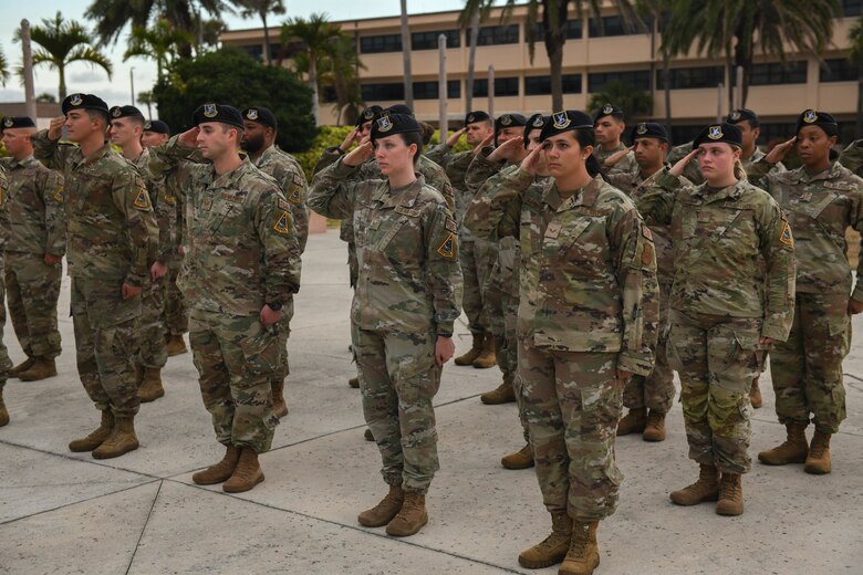 U.S. Air Force 45th Security Forces Squadron defenders, salute the American flag May 20, 2022, at Patrick Space Force Base, Fla. Defenders at the fallen hero ceremony salute the flag to recognize and honor all lives that were lost in the line of service for the United States. (U.S. Space Force photo by Airman 1st Class Samuel Becker)