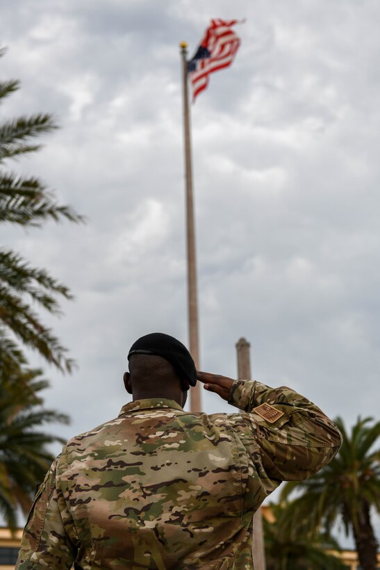 U.S. Air Force Tech. Sgt. Koeal Braxton, 45th Security Forces Squadron flight sergeant, salutes the American flag May 20, 2022, at Patrick Space Force Base, Fla. Airmen at the fallen hero ceremony salute the flag to recognize and honor all lives that were lost in the line of service for the United States. (U.S. Space Force photo by Airman 1st Class Samuel Becker)