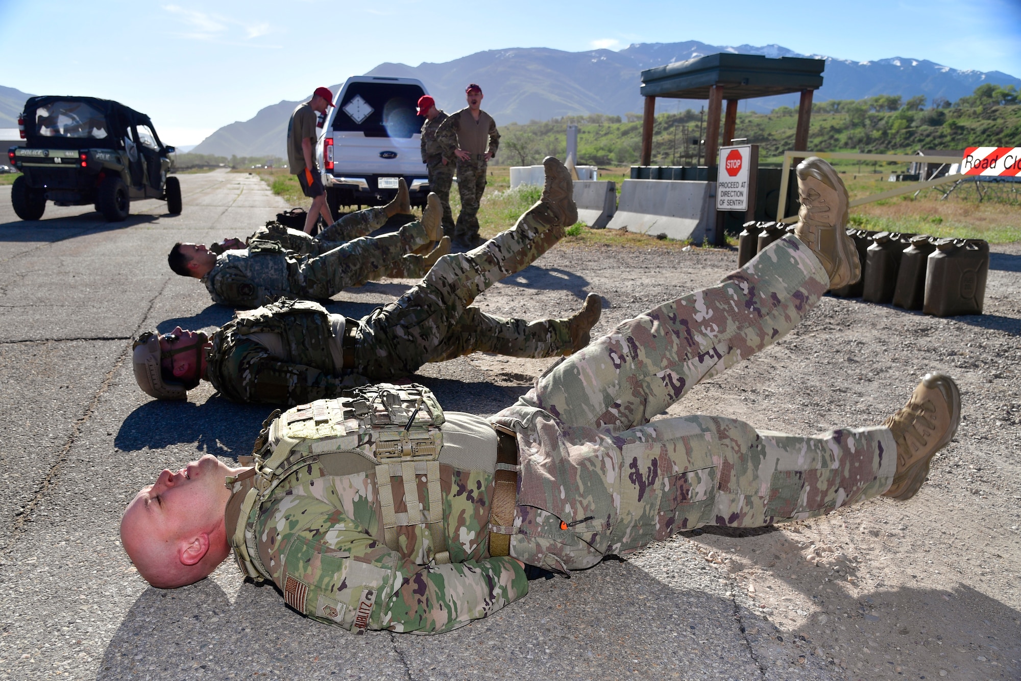 Master Sgt. Timothy Bublitz lays on his back doing flutter kicks.