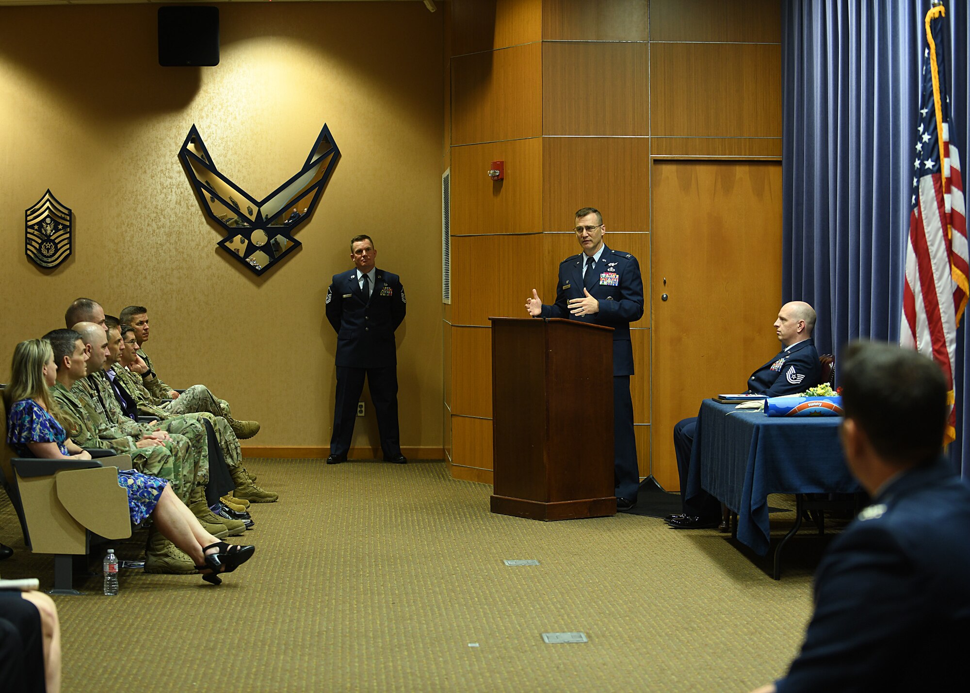 Col Patrick Williams, 557th Weather Wing commander, officiates the 1st Weather Group Change of Command ceremony and highlights the attributes of both incoming and outgoing commanders.