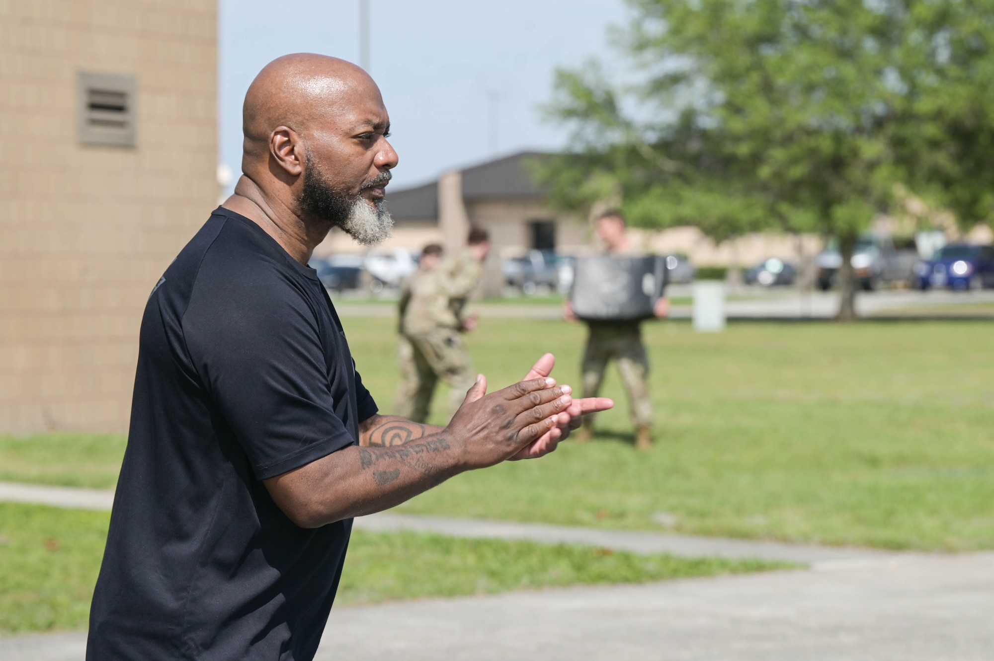 Bobby Cumby, retired security forces and Office of Special Investigations agent, and Krav Maga instructor, motivates the 23rd Security Forces Squadron airmen during situational training rounds, April 13, 2022, at Moody Air Force Base, Georgia. Adding new skills to these defenders’ toolbelts will continue developing security forces in more than just the combative aspect. (U.S. Air Force photo by Senior Airman Rebeckah Medeiros)